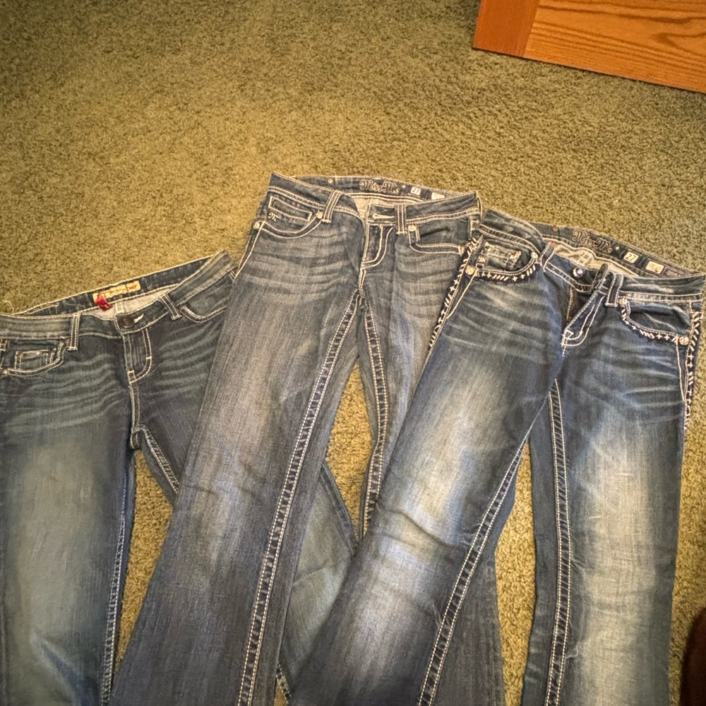 3 pairs of Buckle jeans.